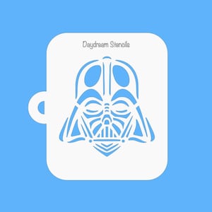 May include: White plastic stencil of Darth Vader's face. The stencil is designed for use with paint or other crafting materials. Daydream Stencils is printed at the top of the stencil.