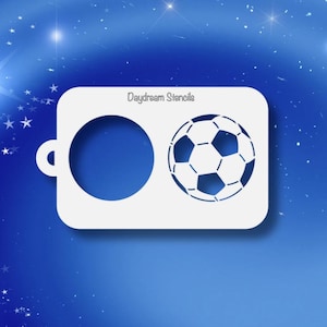 May include: White plastic stencil with the text "Daydream Stencils" and two cutouts: a circle and a soccer ball.