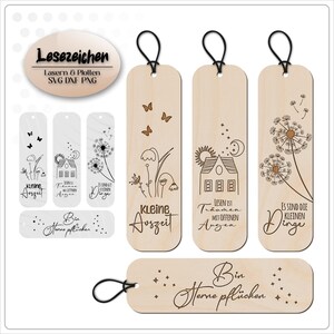 May include: Set of six laser cut wooden bookmarks with various designs. The bookmarks feature dandelion designs, a house with the text "Lesen ist Tr&auml;umen mit offenen Augen", and the text "Kleine Auszeit". One bookmark has the text "Bin gerne pfl&uuml;cken" and another has the text "Es sind die kleinen Dinge".