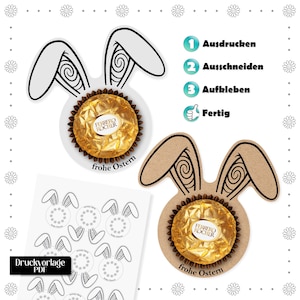 Op de afbeelding: Een Paas knutselproject met konijnenoorknipsels met Ferrero Rocher-chocolade. De afbeelding bevat Duitse instructies: "Ausdrucken, Ausschneiden, Aufkleben, Fertig" (Afdrukken, Knippen, Plakken, Klaar). De woorden "frohe Ostern" (Vrolijk Pasen) zijn ook zichtbaar.