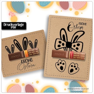 May include: Two brown cards with Easter-themed designs. One card features bunny ears and the text "Frohe Ostern", while the other has bunny ears, a bow tie, and footprints. Both cards have a chocolate bar.
