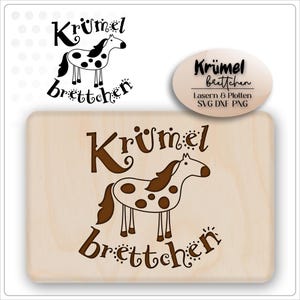 May include: A wooden cutting board with the word "Krümel brettchen" and a cartoon horse design. The horse is white with brown spots and a brown mane and tail. The text and horse are in brown. There is a smaller version of the design in the upper left corner.