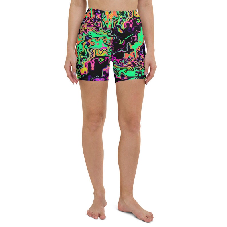 May include: Black athletic shorts with a bright green, pink, orange, and yellow abstract swirl pattern.