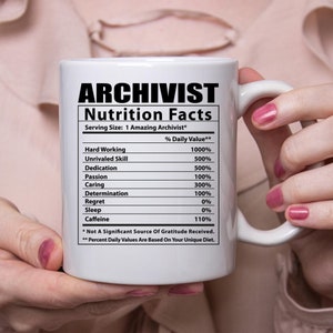 May include: White ceramic mug with a black and white graphic of a nutrition facts label for an "Archivist". The label lists various skills and qualities with percentages, such as "Hard Working 1000%", "Unrivaled Skill 500%", "Dedication 500%", "Passion 100%", "Caring 300%", "Determination 100%", "Regret 0%", "Sleep 0%", and "Caffeine 110%". The text at the bottom of the label reads "* Not A Significant Source Of Gratitude Received. ** Percent Daily Values Are Based On Your Unique Diet."