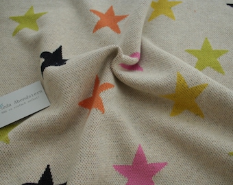 Knitted fabric light beige with colorful stars