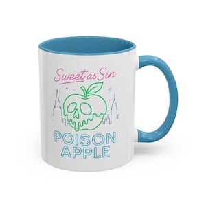 May include: White ceramic mug with a blue interior and handle. The mug features a green, stylized apple design with a skull face, and the words "Sweet as Sin" and "Poison Apple" in pink and blue.