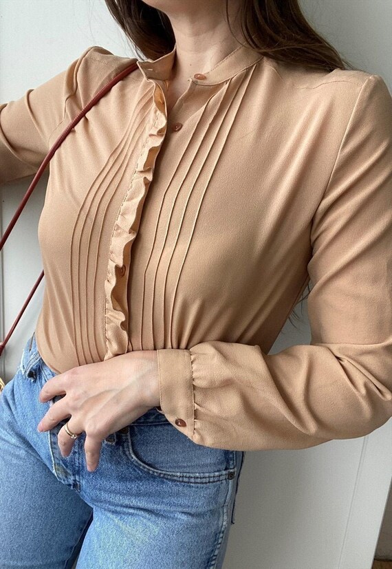 beige ruffle blouse