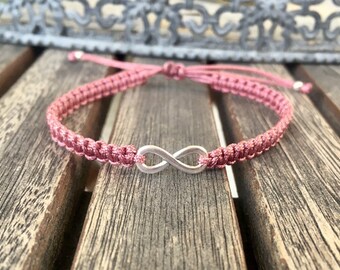 Hand-knotted bracelet with silver infinity symbol