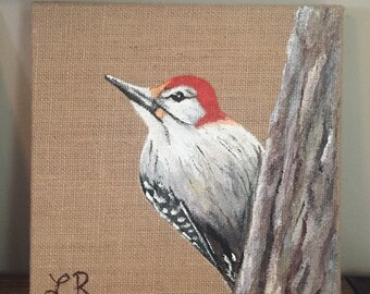 Hand painted woodpecker with acrylic on burlap canvas. Wonderful piece for any home.