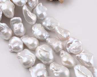 May include: A strand of white baroque pearls with an irregular, organic shape and a high-luster, iridescent finish. The pearls are arranged in a cluster, and the text YouPearlSandDIY is printed in the bottom right corner of the image.