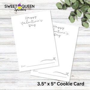 Puede incluir: Dos tarjetas de galletas en blanco de 3,5 x 5 pulgadas con el texto "Happy Valentine's Day" impreso en ellas. Las tarjetas son blancas y tienen un diseño simple.