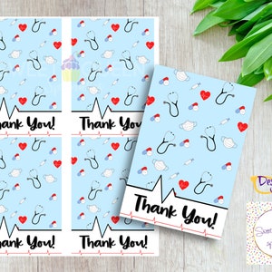May include: Cards with a light blue background featuring medical symbols like stethoscopes, hearts, and face masks. The words "Thank You!" are printed in black with a red heartbeat line. The cards are designed for healthcare professionals.
