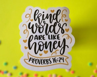 May include: White sticker with black calligraphy that reads "Kind words are like honey" and gold lettering that reads "Proverbs 16:24".