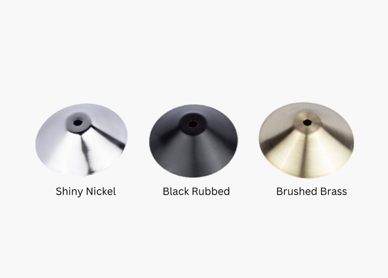 May include: Three metal lamp finials in different finishes: shiny nickel, black rubbed, and brushed brass.