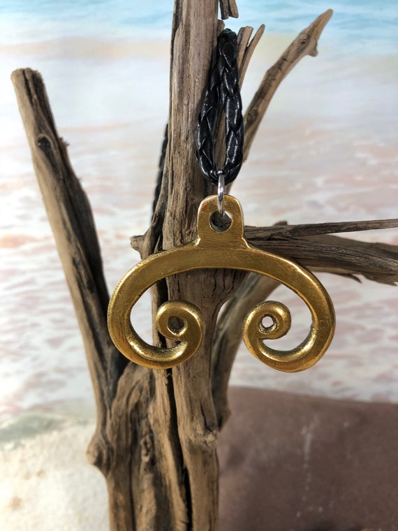 Brass Viking Luna pendant reproduced from a museum piece by us.