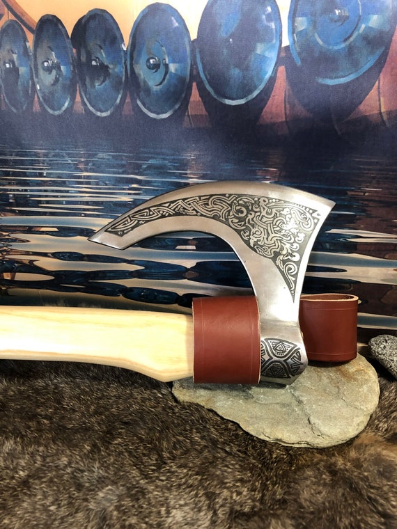 Viking Fenrer battle hatchet. High carbon D3 tool steel 55 on the Rockwell scale. Polished and engraved and sharpened. Includes belt hanger.