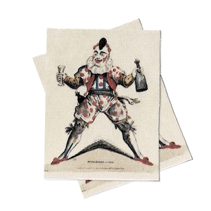 May include: A vintage illustration of a clown holding a glass of wine and a bottle of wine. The clown is wearing a red and white polka dot costume with a blue vest. The illustration is printed on a piece of fabric.
