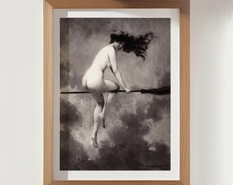 May include: A framed black and white print of a nude figure riding a broomstick through a cloudy sky. The artwork is in a wooden frame, adding a classic touch to the image. The print evokes a sense of fantasy and mythology.
