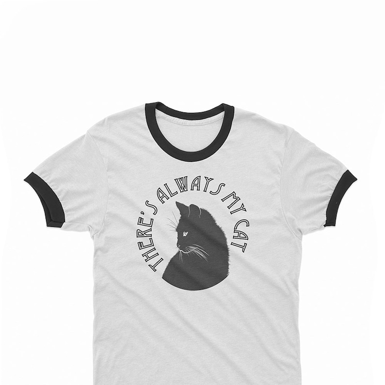 May include: White t-shirt with a black ringer and a black silhouette of a cat with the text "There's always my cat" in a circle.