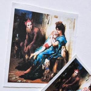 May include: Two fabric patches featuring a classical painting with figures in a dark, indoor setting. One patch shows a seated figure in red, while the other depicts a woman in blue holding a child, with an owl and dog nearby.