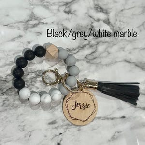 silicone wristlet, personalized keys, beaded keychain, custom name gift, keychain wallet, bridesmaid favor, teacher present, hands free holder, engraved pendant, mothers day idea, stretch bracelet, gift for women, trendy accessories, personalized wristlet keychain, custom beaded wristlet, name keychain gift, silicone bead bracelet, wallet wristlet keychain, engraved wood disc keychain, bridesmaid proposal favor, teacher appreciation gift, handsfree key holder, womens personalized keychain