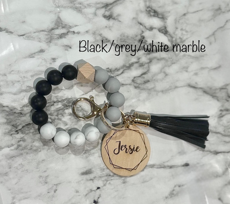 silicone wristlet, personalized keys, beaded keychain, custom name gift, keychain wallet, bridesmaid favor, teacher present, hands free holder, engraved pendant, mothers day idea, stretch bracelet, gift for women, trendy accessories, personalized wristlet keychain, custom beaded wristlet, name keychain gift, silicone bead bracelet, wallet wristlet keychain, engraved wood disc keychain, bridesmaid proposal favor, teacher appreciation gift, handsfree key holder, womens personalized keychain