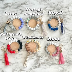 silicone wristlet, personalized keys, beaded keychain, custom name gift, keychain wallet, bridesmaid favor, teacher present, hands free holder, engraved pendant, mothers day idea, stretch bracelet, gift for women, trendy accessories, personalized wristlet keychain, custom beaded wristlet, name keychain gift, silicone bead bracelet, wallet wristlet keychain, engraved wood disc keychain, bridesmaid proposal favor, teacher appreciation gift, handsfree key holder, womens personalized keychain