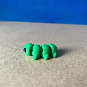 Ledad larv fidgetleksak eller nyckelring