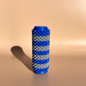 Dubbelfärgad taggig sensorisk rulle och klicker: Fast texturerad fidgetleksak