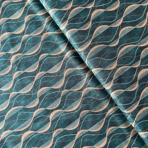 Groene en beige patchworkstof van Marcus Brothers
