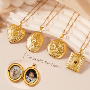 May include: Gold-colored locket necklaces in various shapes: heart, oval, round, and rectangular. Each locket is intricately detailed and hangs on a delicate chain. One locket is open, revealing two photos. The text "SHIPS NEXT DAY" is visible.