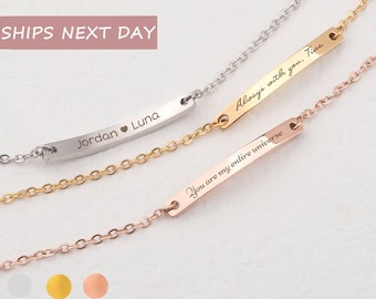 May include: Three silver, gold, and rose gold bar bracelets with personalized engravings. The silver bracelet says "Jordan Luna" with a heart symbol between the names. The gold bracelet says "Always with you. Tina". The rose gold bracelet says "You are my entire universe".