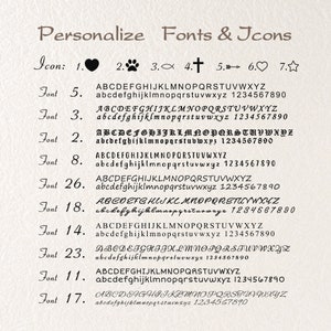 May include: A chart showing different font styles and icons for personalization. The chart includes a heart, paw print, fish, cross, arrow, star, and various font styles with the alphabet and numbers.