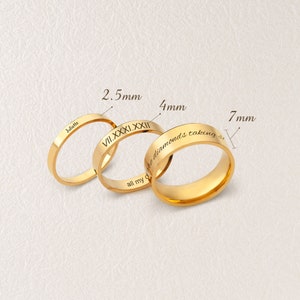 May include: Three gold rings with different widths: 2.5 mm, 4 mm, and 7 mm. The rings are engraved with the words "Juliette", "VII.XXXI.XXXII", and "all my diamonds taking us".