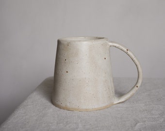 Small handmade ceramic mug in pebble glaze