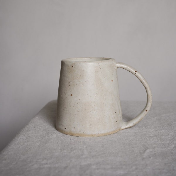 Small handmade ceramic mug in pebble glaze
