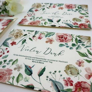 May include: A white card with a floral design and the text "Vielen Dank" for the congratulations and gifts for our wedding. It was a wonderful day. Kira & Steve.
