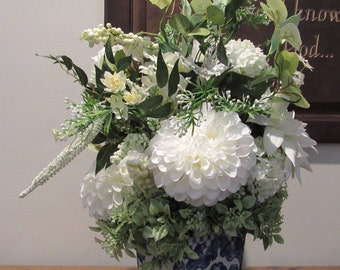 Designer While Dahlia  Peony White berries and Greenery in a Ceramic Classic Decorated Container