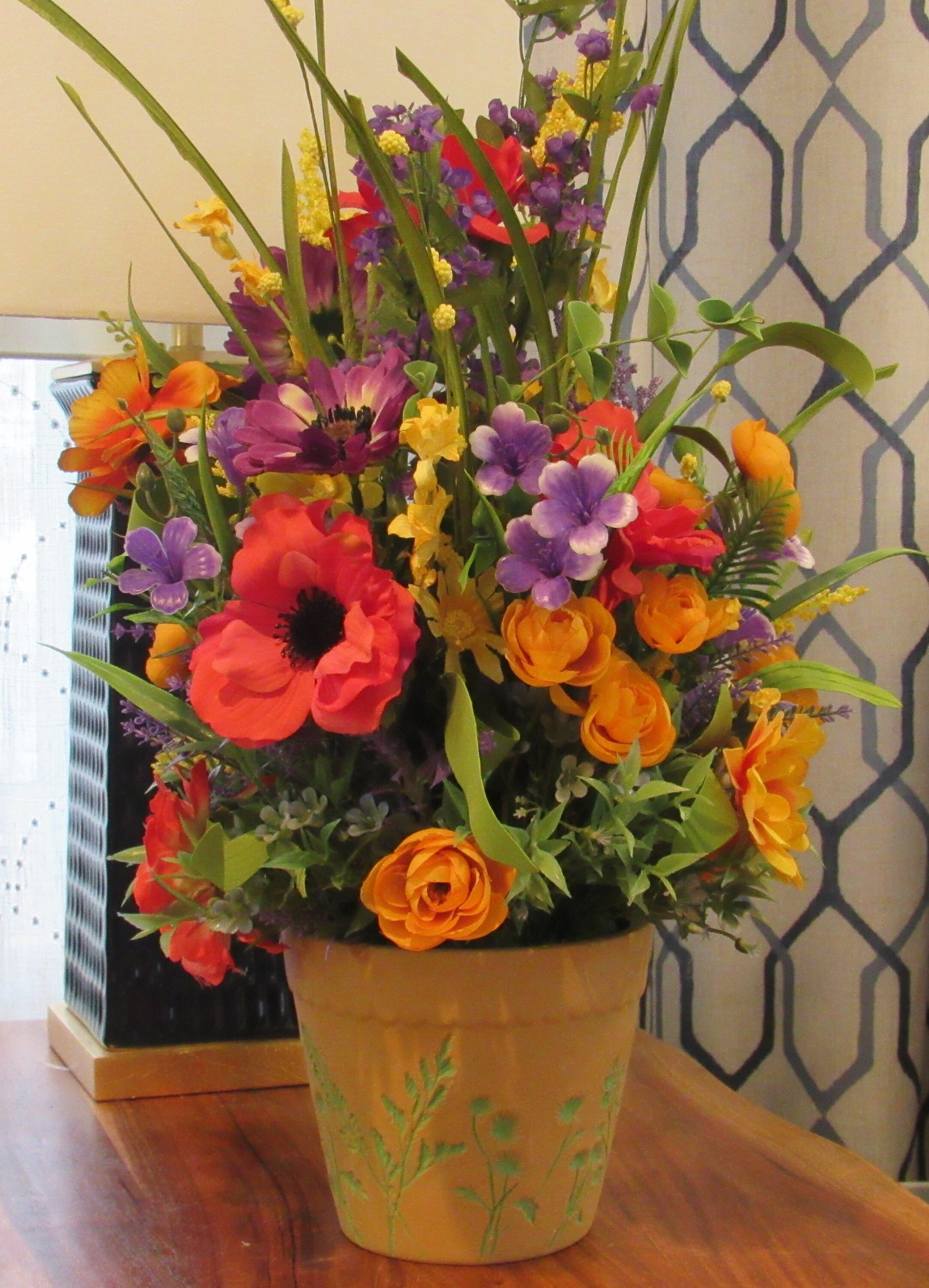 Designer Vibrant Color Wildflower Arrangement in Clay like etched container