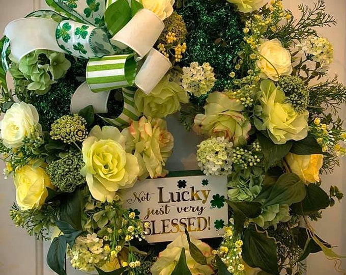 Featured listing image: Designer Yellow Rose and green hydrangea St. Patricks Day Wreath with hand tied shamrock  and green and white bows.