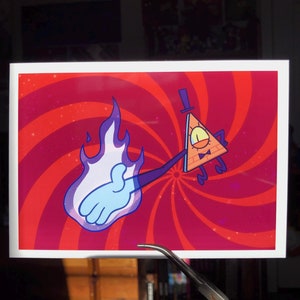 May include: A rectangular print featuring a cartoon character with a triangular body, a top hat, and a bow tie. The character is set against a swirling red and pink background. A blue and white flame-like hand extends from the character.