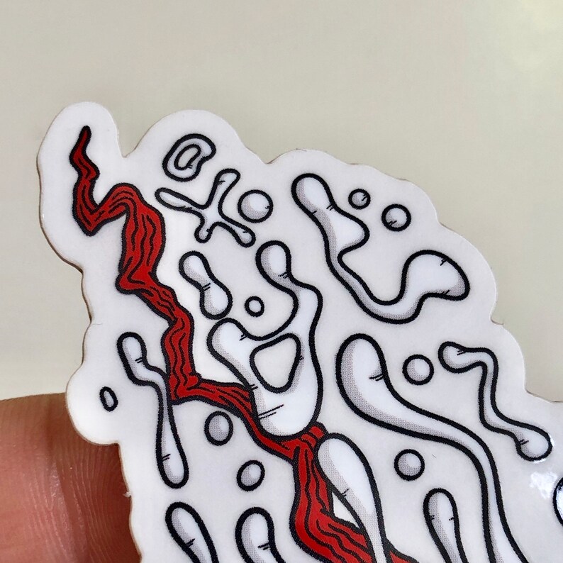 This image shows a zoomed in close up view of the melting eyeball sticker to illustrate its level of detail.
