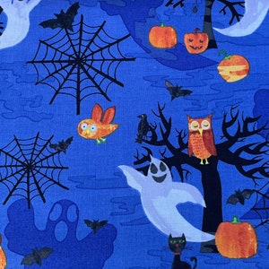 May include: A blue fabric with a Halloween theme featuring owls, bats, ghosts, pumpkins, and spiderwebs.