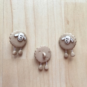Sheep buttons with dangling legs 18 mm 2 pieces in beige