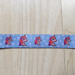 1 m bande web avec Licorne en bleu par Union bouton