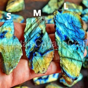 May include: Three labradorite crystal pieces in various sizes labelled S, M, and L. The crystals are iridescent with shades of blue, green, and gold.