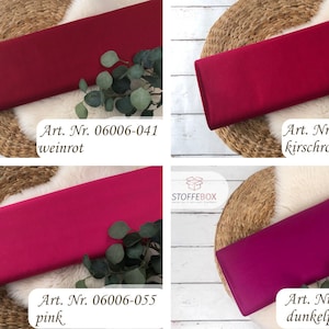 May include: Four fabric swatches in different shades of red and pink. The swatches are labeled with their corresponding article numbers and color names: "Art. Nr. 06006-041 weinrot", "Art. Nr. 06006-040 kirschrot", "Art. Nr. 06006-055 pink", and "Art. Nr. 01805-217 dunkelpink".