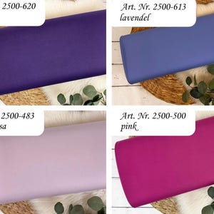May include: Four fabric samples in shades of purple, lavender, light pink, and hot pink. Each fabric is labeled with an article number and color name: lila, lavendel, hellaltrosa, and pink. The fabrics are arranged on a textured surface with greenery.