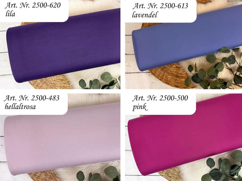 May include: Four fabric samples in shades of purple, lavender, light pink, and hot pink. Each fabric is labeled with an article number and color name: lila, lavendel, hellaltrosa, and pink. The fabrics are arranged on a textured surface with greenery.