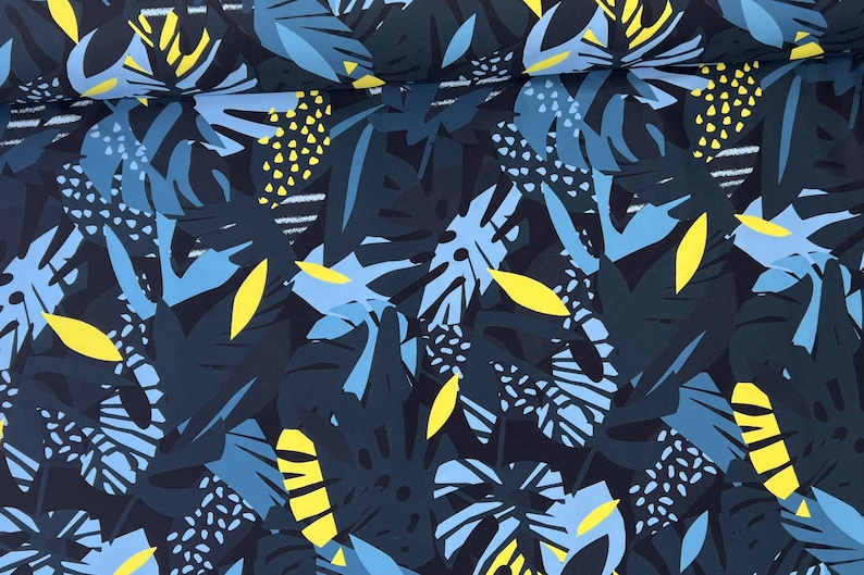 May include: A dark blue fabric with a repeating pattern of blue and yellow stylized leaves. The fabric has a tropical theme.
